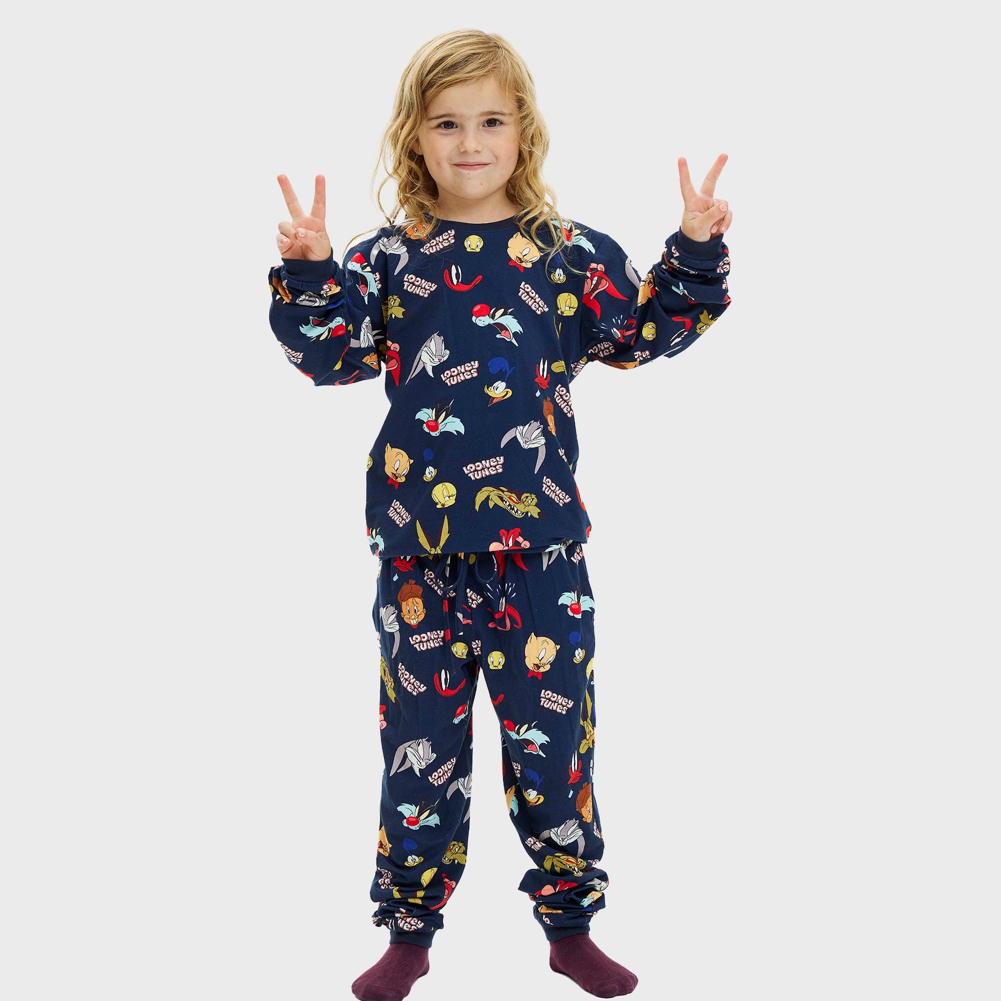 Kinder Weihnachtspyjama in Dunkelblau mit bunten Looney Tunes Motiven, weihnachtspullover kinderdesign.